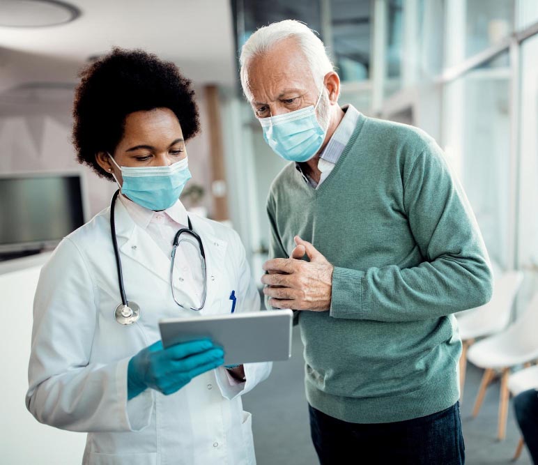female doctor explaining senior man